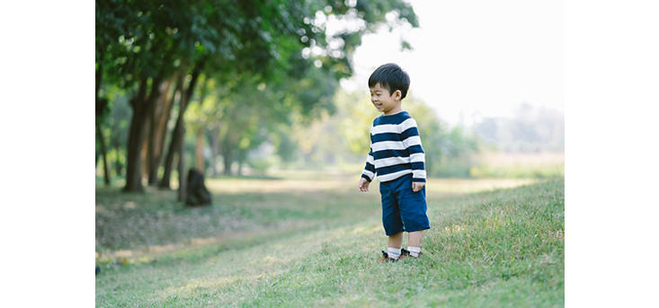 boy age 3 in a field